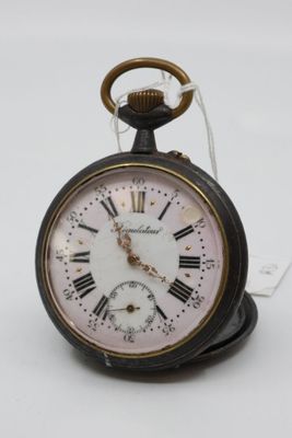 a black and white clock with roman numerals on it