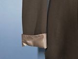 a close up of a brown jacket with a satin collar
