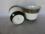 two cups sitting next to each other on a table