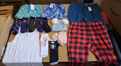 a box of clothing and a pair of gloves on a table