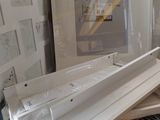 a picture of a pile of framed pictures on a table