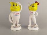 two figurines of a man and a woman with a smile on their faces