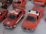 a lot of toy cars that are sitting on a table