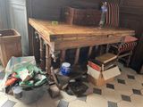 a table with a wooden top in a room with a checkered floor