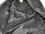 a black leather jacket with a black tie on it