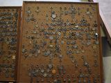 a wooden box with a bunch of metal objects on it