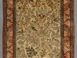 tapis persan ancien à motif floral sur fond beige
