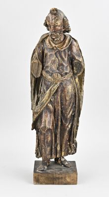 statue of a man in a robe holding a sword on a wooden base