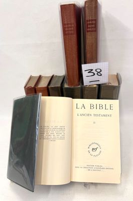 several books are stacked on top of each other on a table