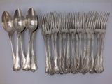 a lot of silver spoons and forks on the table