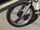 a dirt bike parked on the side of the road