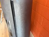 an image of a refrigerator with a zipper on the door