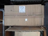 two boxes stacked on top of each other on the street