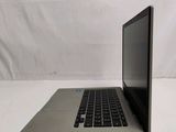 a laptop that is sitting on a white surface