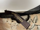 a close up of a purse with a label on it