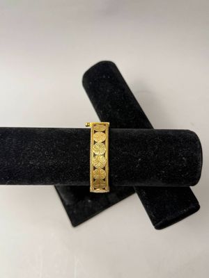 Bracelet jonc en or jaune 750°/°° articulé à décor de pastil… - Photo 1