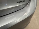 a close up of a car ' s emblem on the side of the car