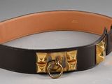 a black belt with a gold buckle on it
