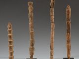 three pieces of wood are sitting on a table