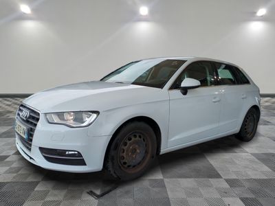 the white car is parked in a large room with a checkered floor