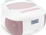 an image of a pink and white clock radio sitting on top of a white table