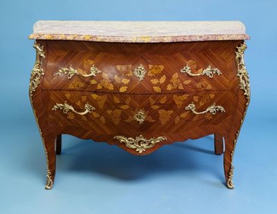 a chest of drawers with a marble top on a blue background