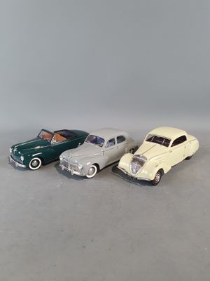 three toy cars that are sitting next to each other