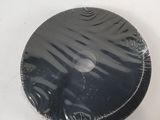 a black object that is sitting on a white surface