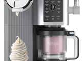 an ice cream cone sitting next to a coffee maker