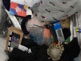 a plastic bag full of clothes and a cell phone