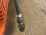 a close up of a drill on the floor