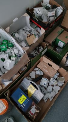 many boxes of electronic equipment sitting on the floor