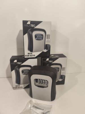 three boxes of electronic locks are sitting on a white surface