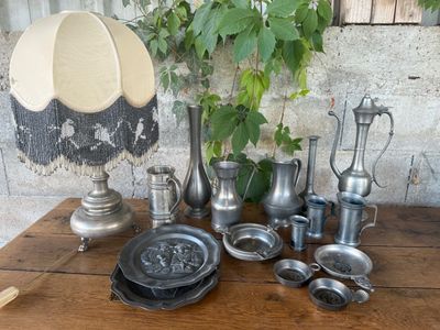 a table that has a lot of silver items on it