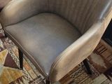 two chairs that are sitting in front of a window
