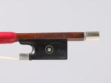 a violin bow that is attached to a string