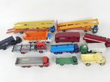 a lot of toy trains and trucks on a white surface