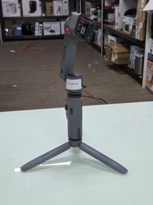 a camera that is sitting on a tripod on a table