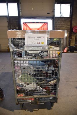a cart with a lot of items in it in a warehouse