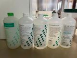 several bottles of liquid sitting on top of a counter next to each other