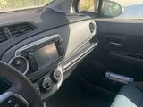 the interior of a car with a steering wheel, dashboard, and dashboard controls