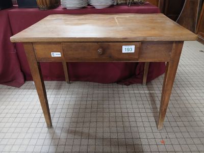 a wooden table with a drawer on top of it