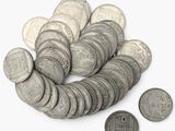 une pile de pièces d'argent sur une surface blanche