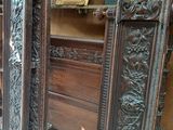 a room with a lot of wooden furniture in it