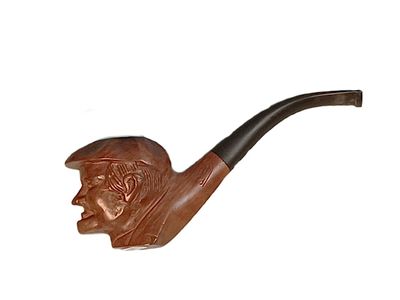 Pipe en bois sculpté d'une tête d'homme coiffé d'uns casquet…