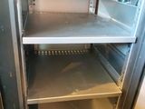 a metal shelf that has some shelves in it