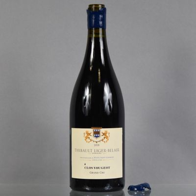 a bottle of wine that is sitting on a table