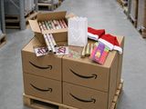 an image of a cardboard box with a package on top of it in a warehouse
