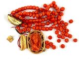 an image of a red beaded necklace with a gold clasp and a red bead necklace with a gold clasp and a red bead necklace with a gold clasp