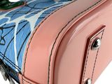 a pink suitcase with a blue and white design on it